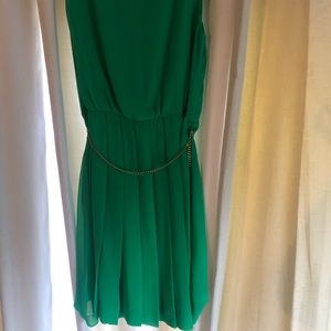 Lovely sleeveless green dress with a chiffon overlay. Side zipper. Size 14